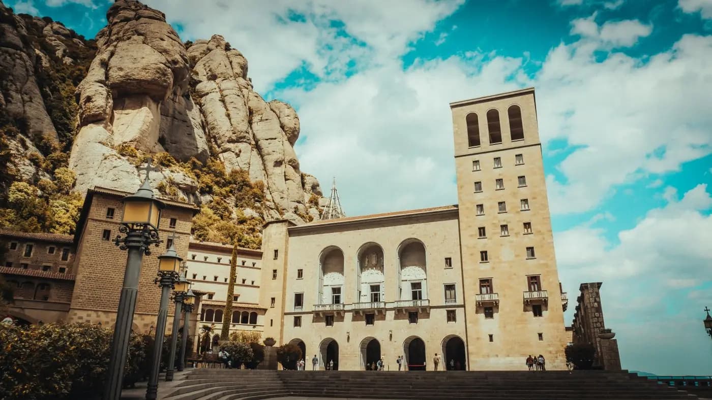 Montserrat monastery at the foot of jagged rock spires