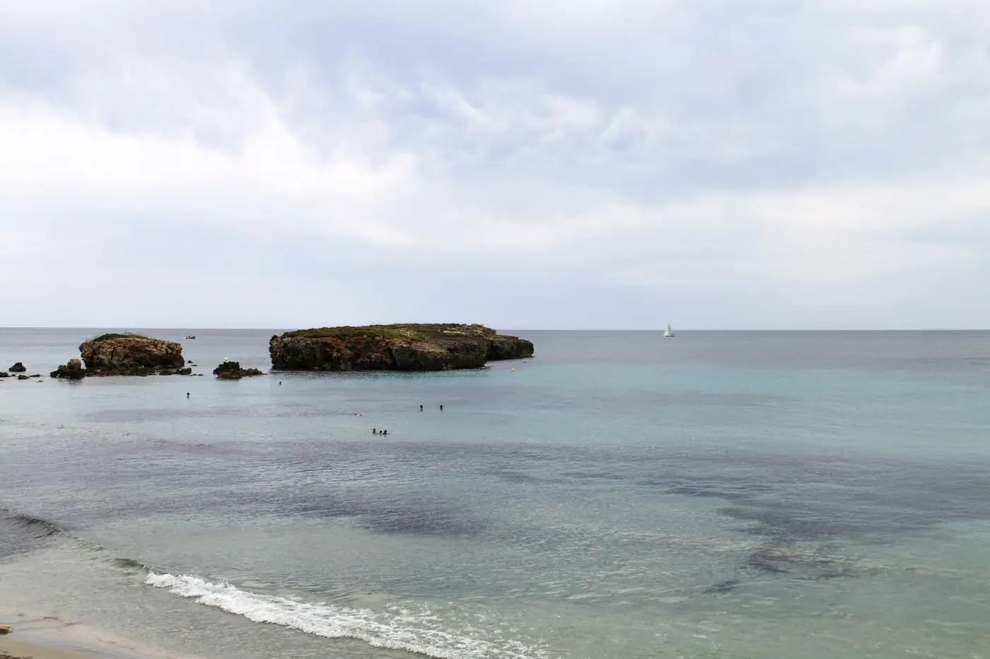 Turquoise sea and rocky islets on the Menorca coast
