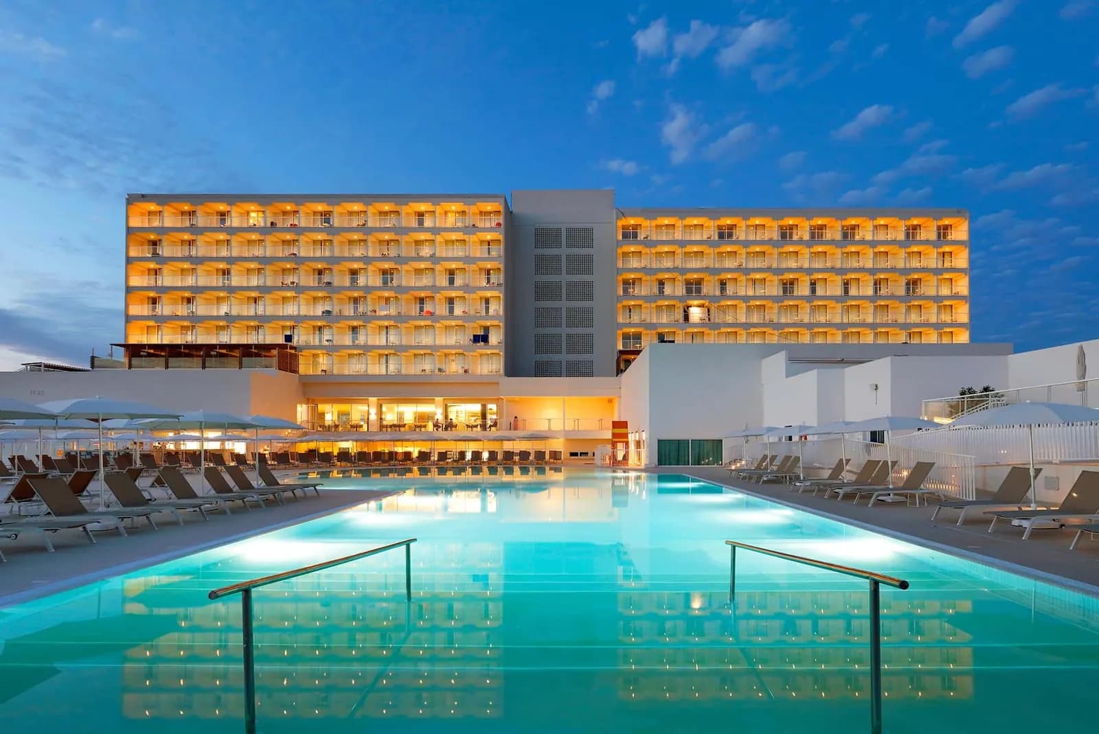 Facade and main pool of Palladium Hotel Menorca in Arenal d'en Castell