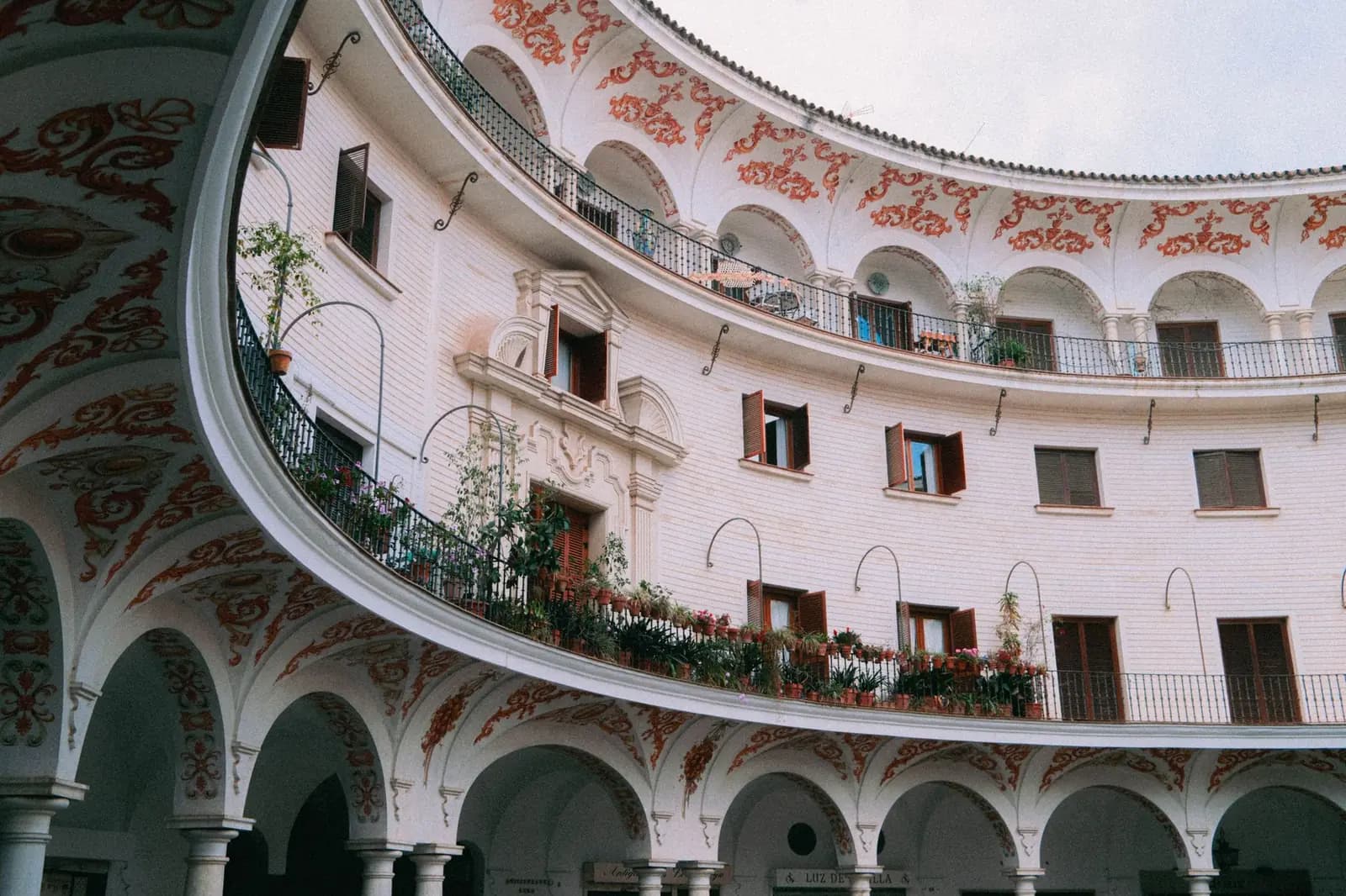 Arcaded gallery and ornate balcony in an Andalusian palace