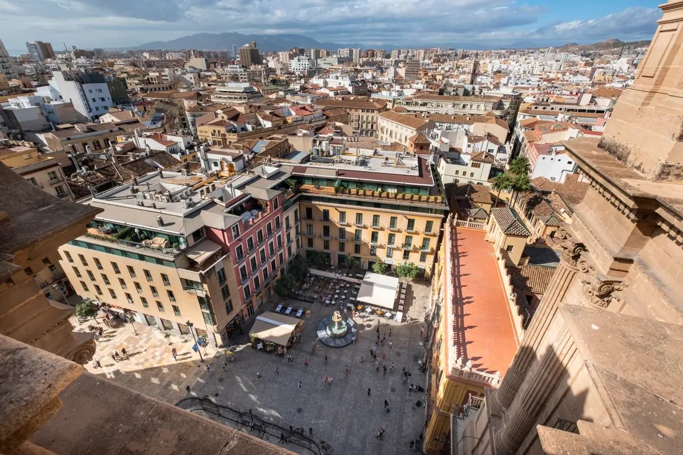 Aerial view of a lively historic square in central Málaga