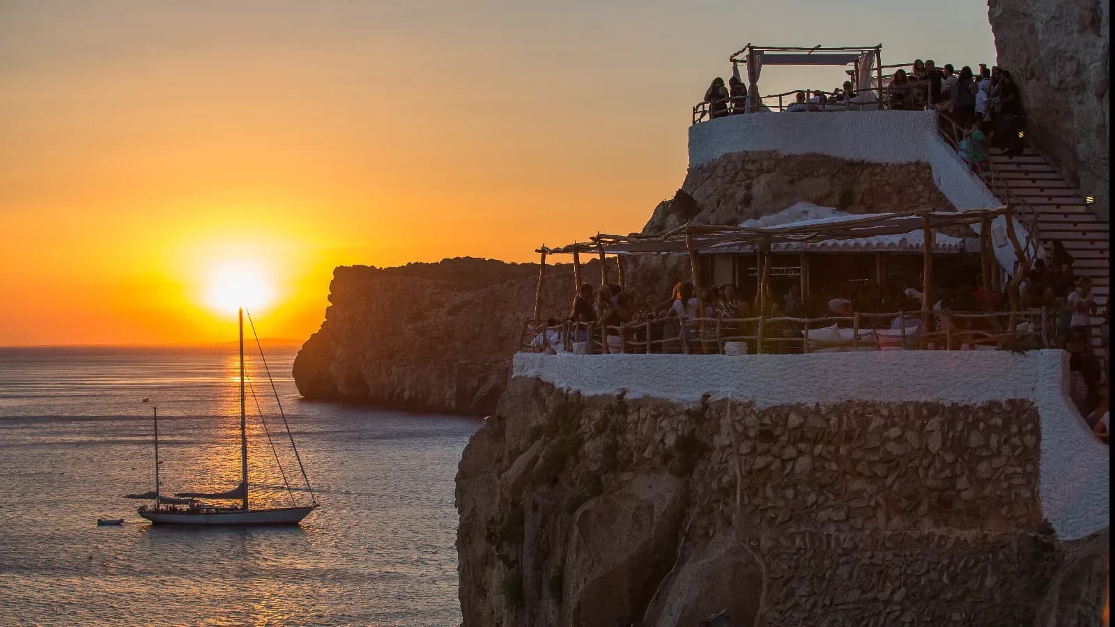 Cova d'en Xoroi terrace at sunset, facing the sea