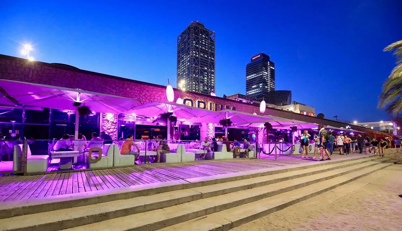 Opium Barcelona night terrace with purple lighting and city view