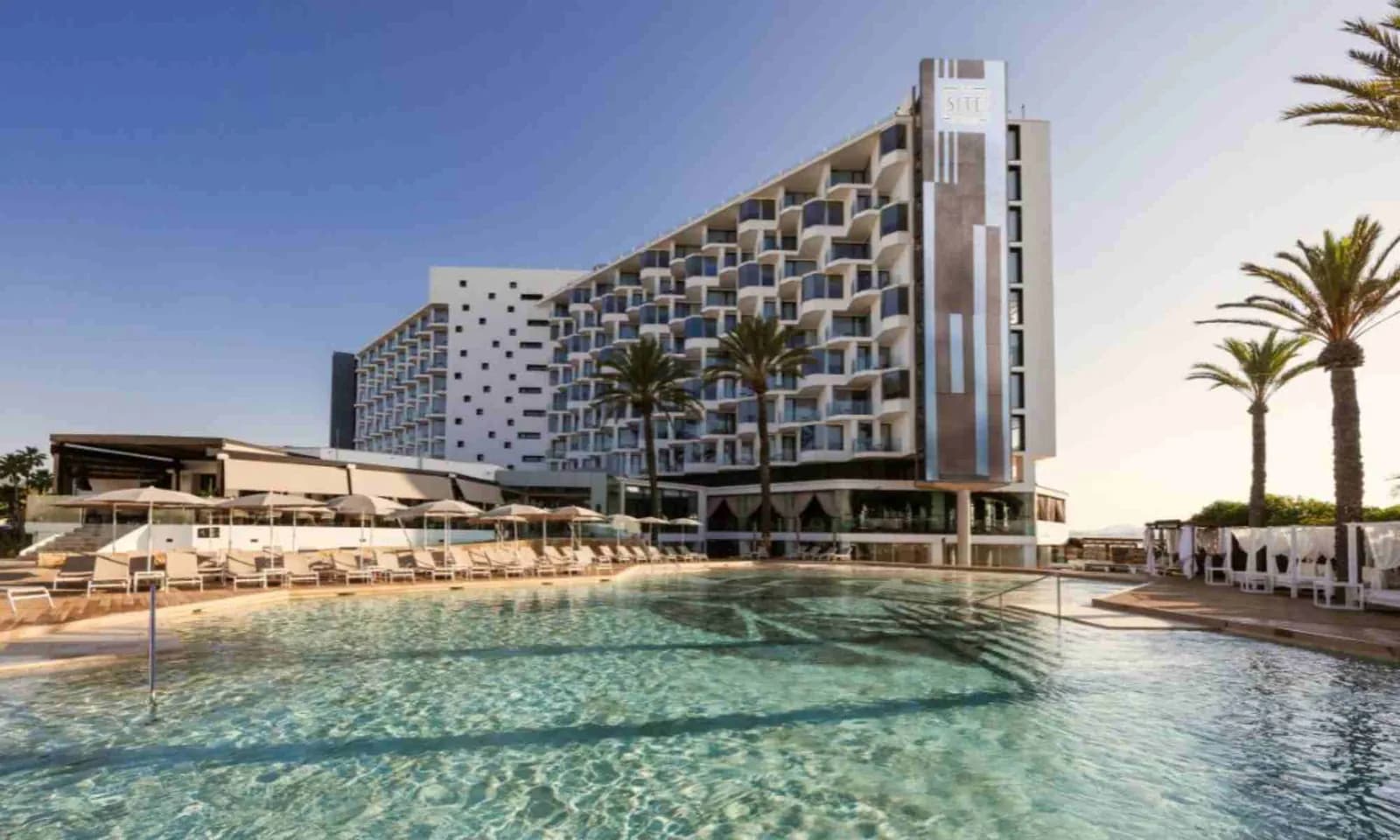 BLESS Ibiza The Site facade and pool by the sea at Playa d'en Bossa