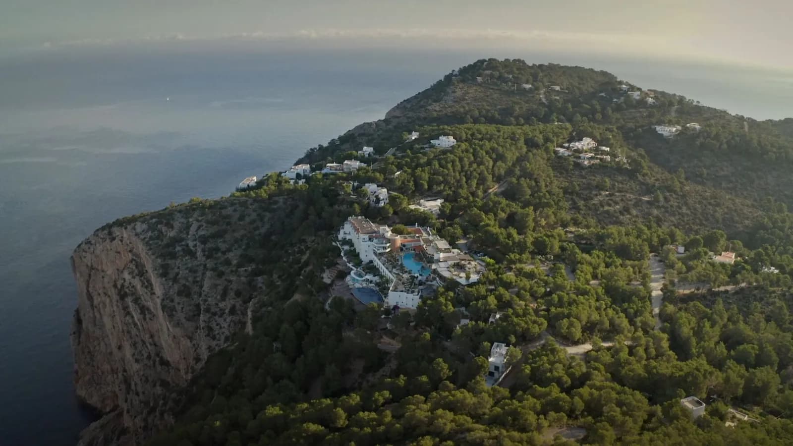 Aerial view of Hacienda Na Xamena hotel perched on the cliffs of Ibiza