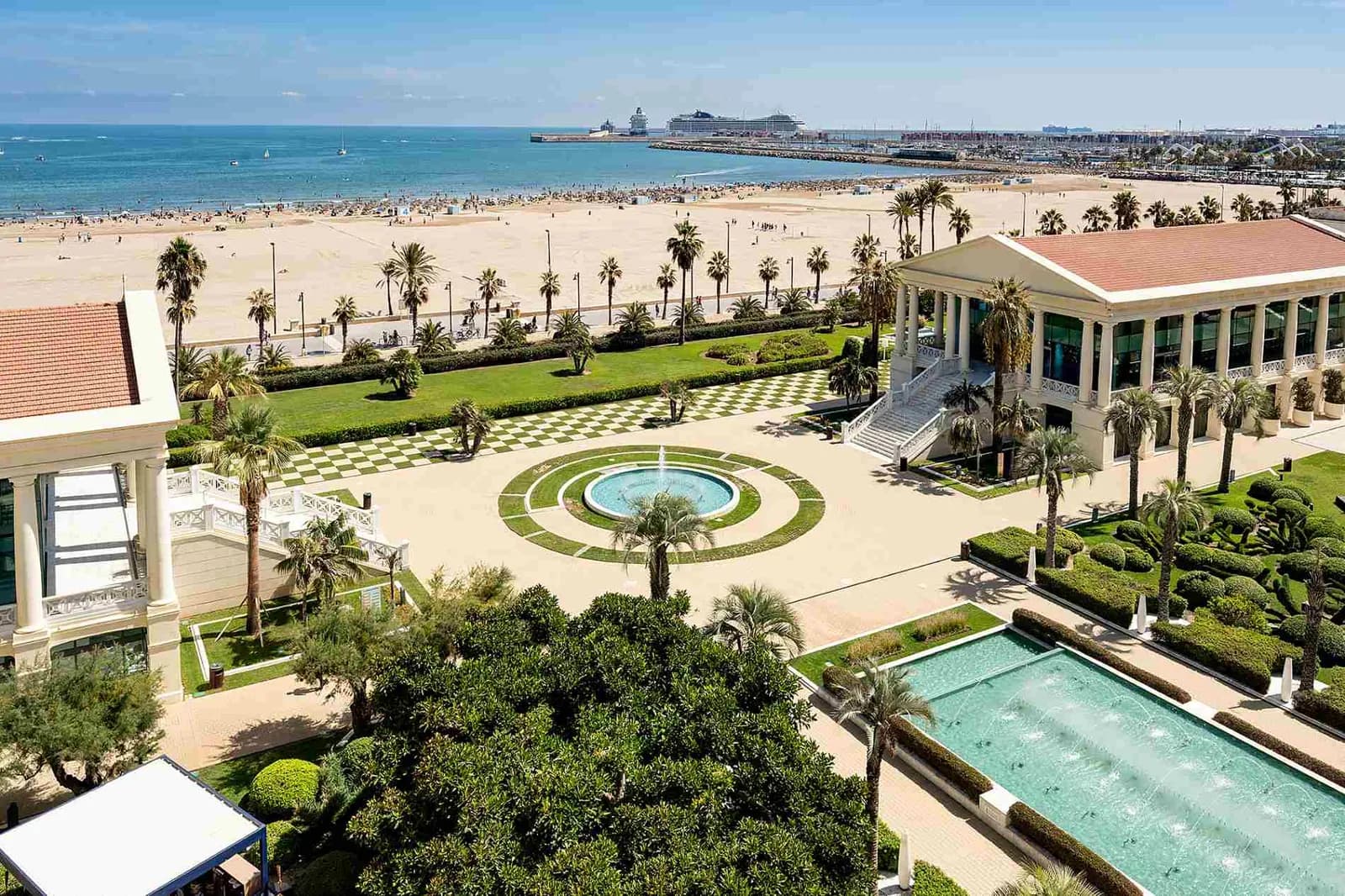 Aerial view of Hotel Balneario Las Arenas facade and gardens facing the beach in Valencia