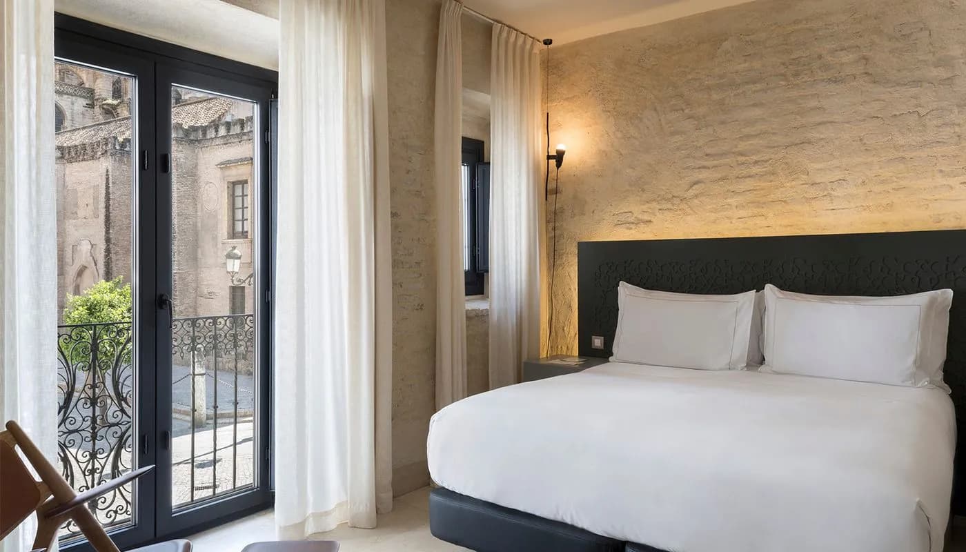 Suite with balcony facing Seville Cathedral at EME Catedral Hotel