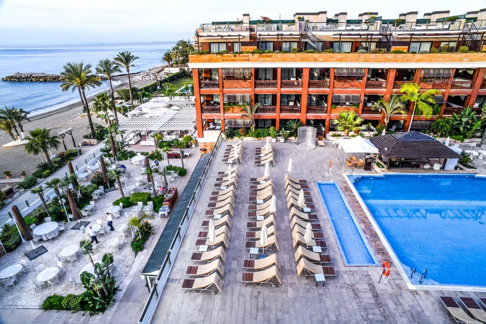 Gran Hotel Guadalpín Banús facade and outdoor pool facing the beach in Marbella