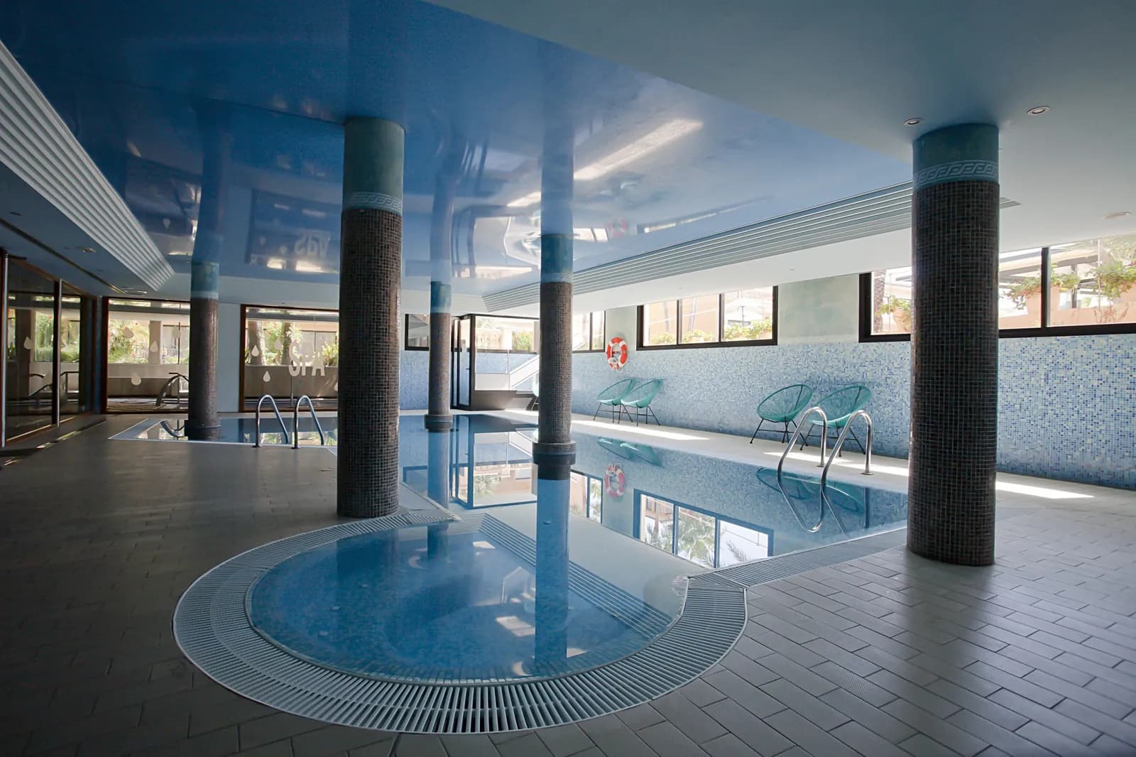Indoor pool with columns at Mon Port Hotel & Spa in Port d'Andratx