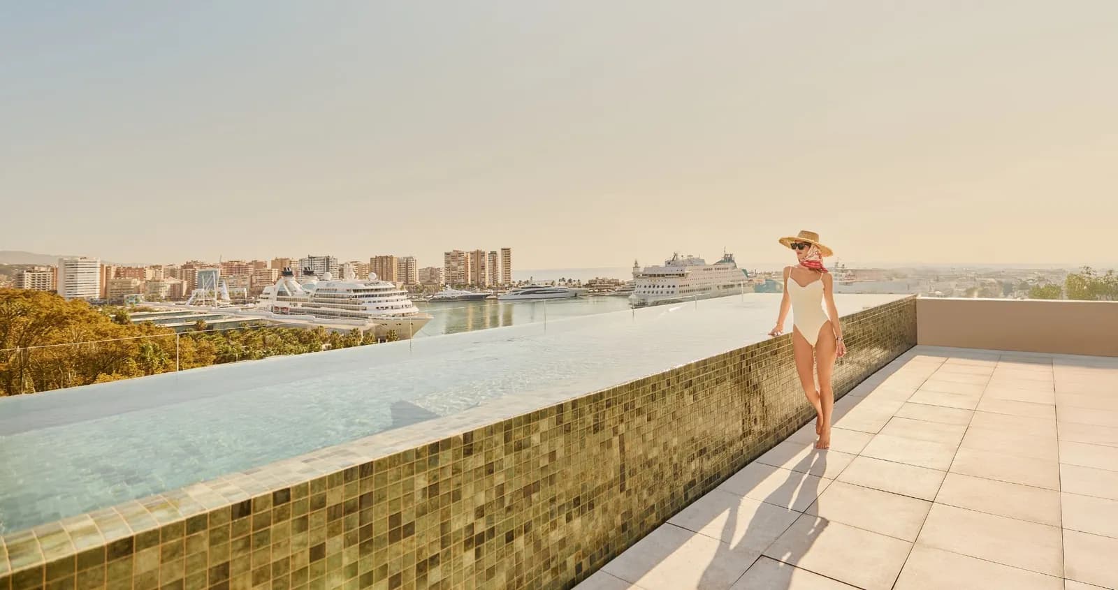 Infinity pool on the rooftop of Only YOU Hotel Málaga, view over the port