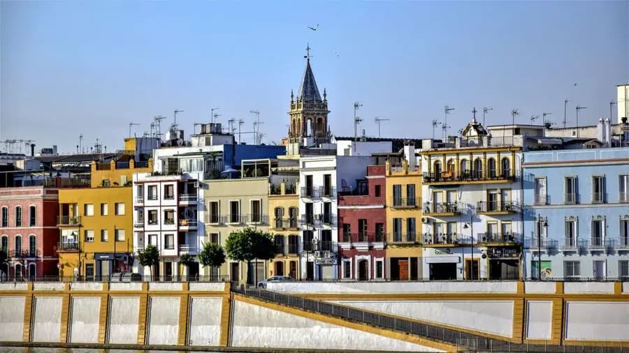 Colourful facades on Calle Betis in Seville before departures