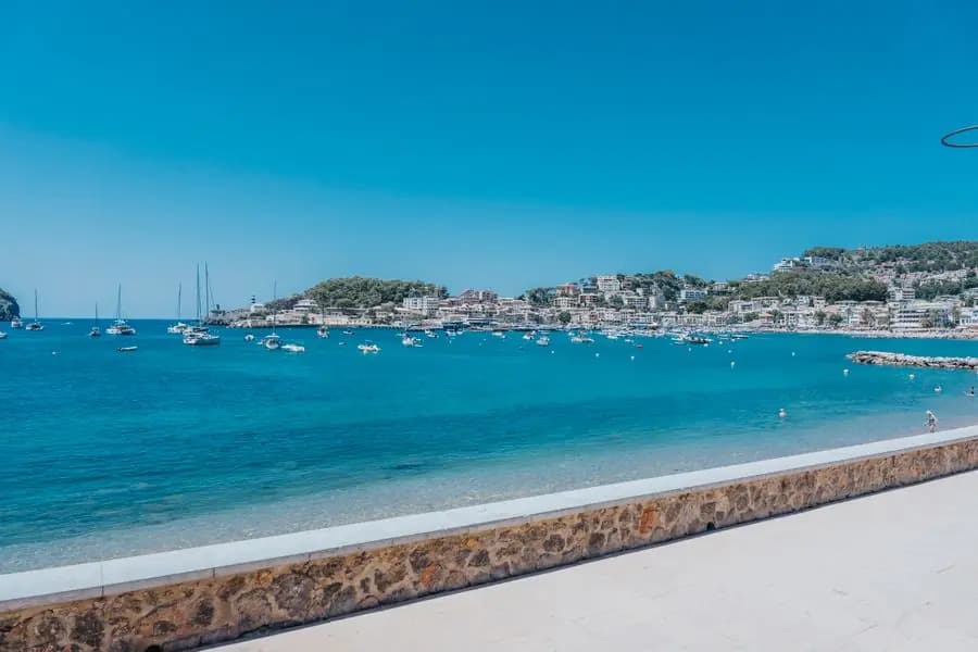 Port de Sóller bay, moored boats and a stone sea wall