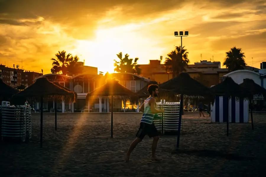 Valencia beach at sunset, golden light on the sand