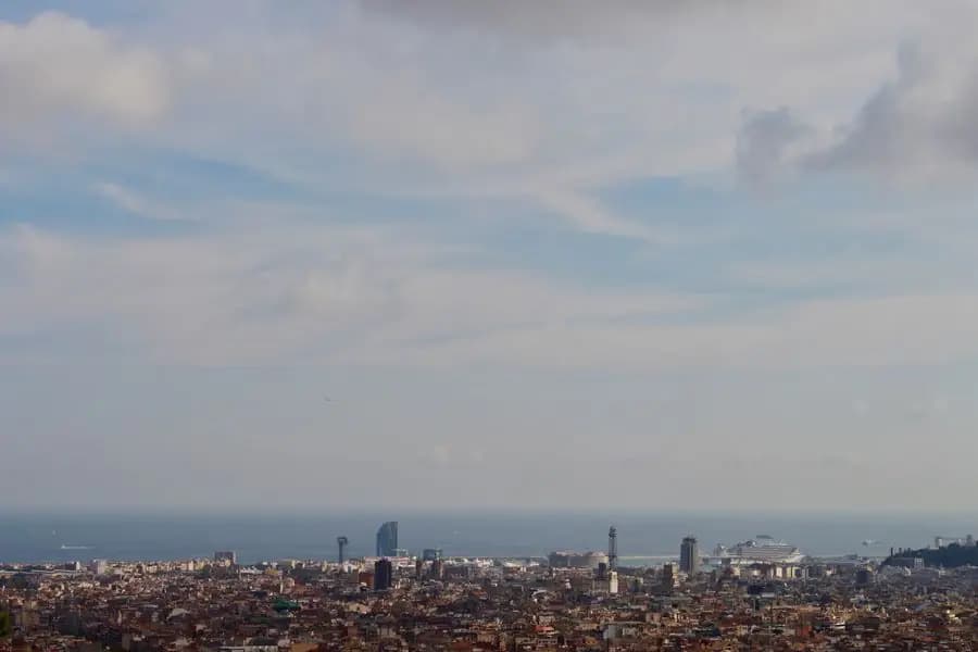Panoramic view over Barcelona's rooftops and the sea