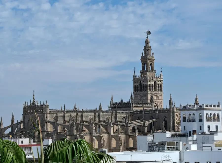 The Giralda and Seville Cathedral under a clear blue sky
