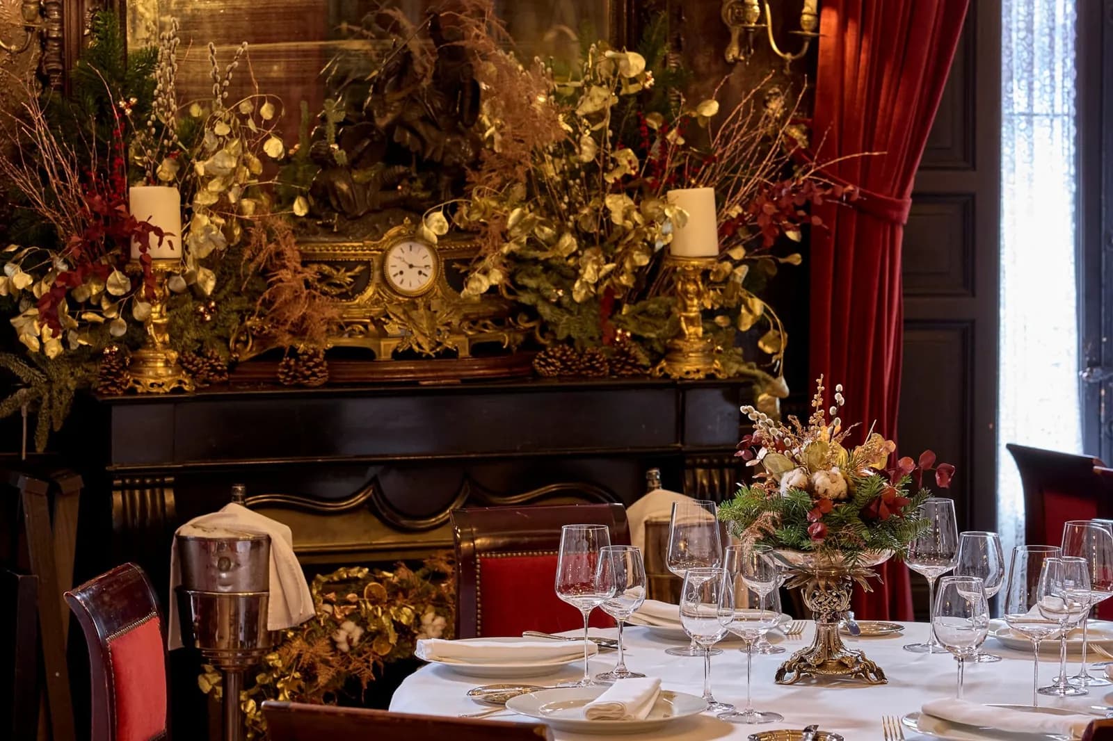 Festive table set with golden flowers and candles at Lhardy