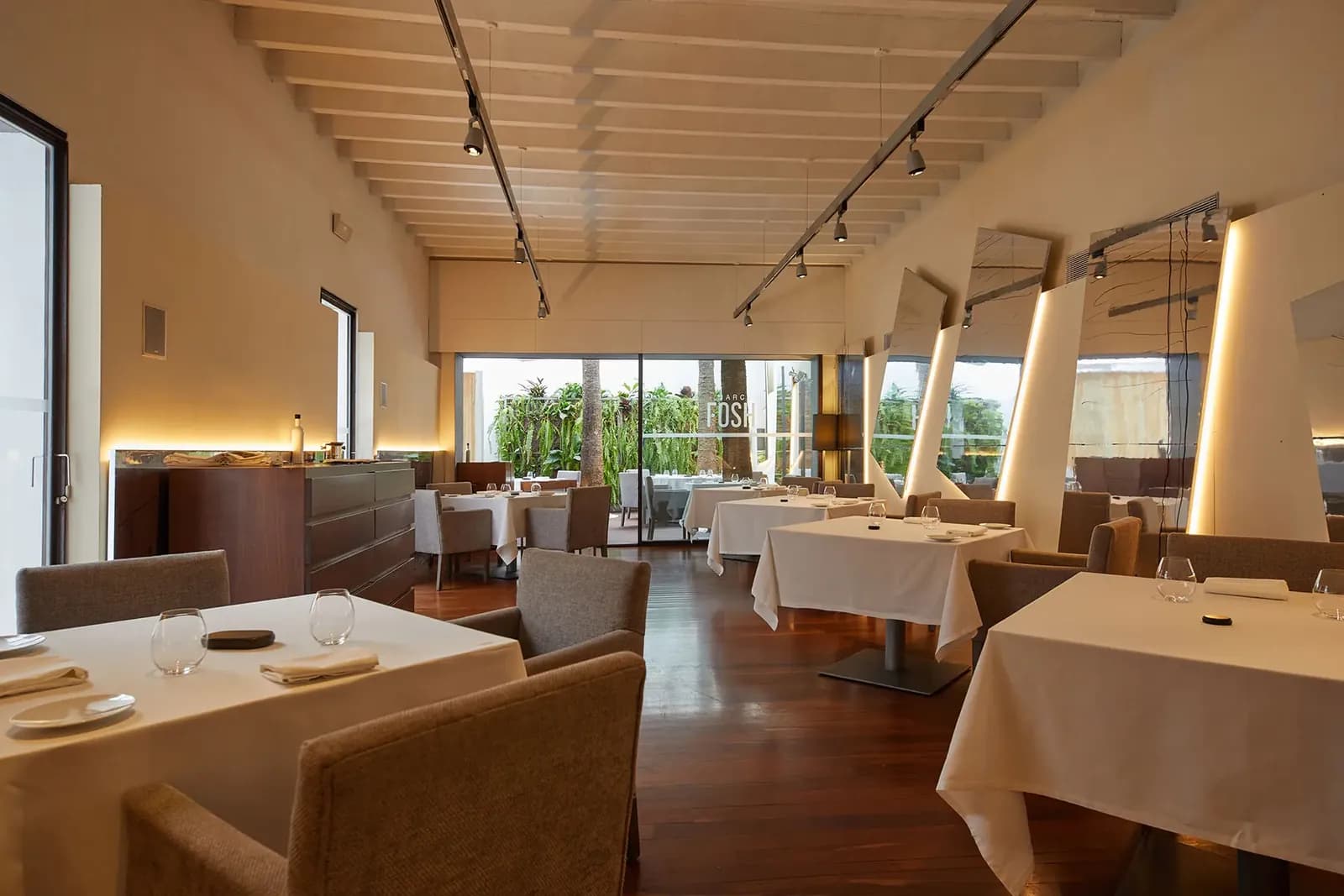 Dining room at Marc Fosh in Palma with laid tables and large windows
