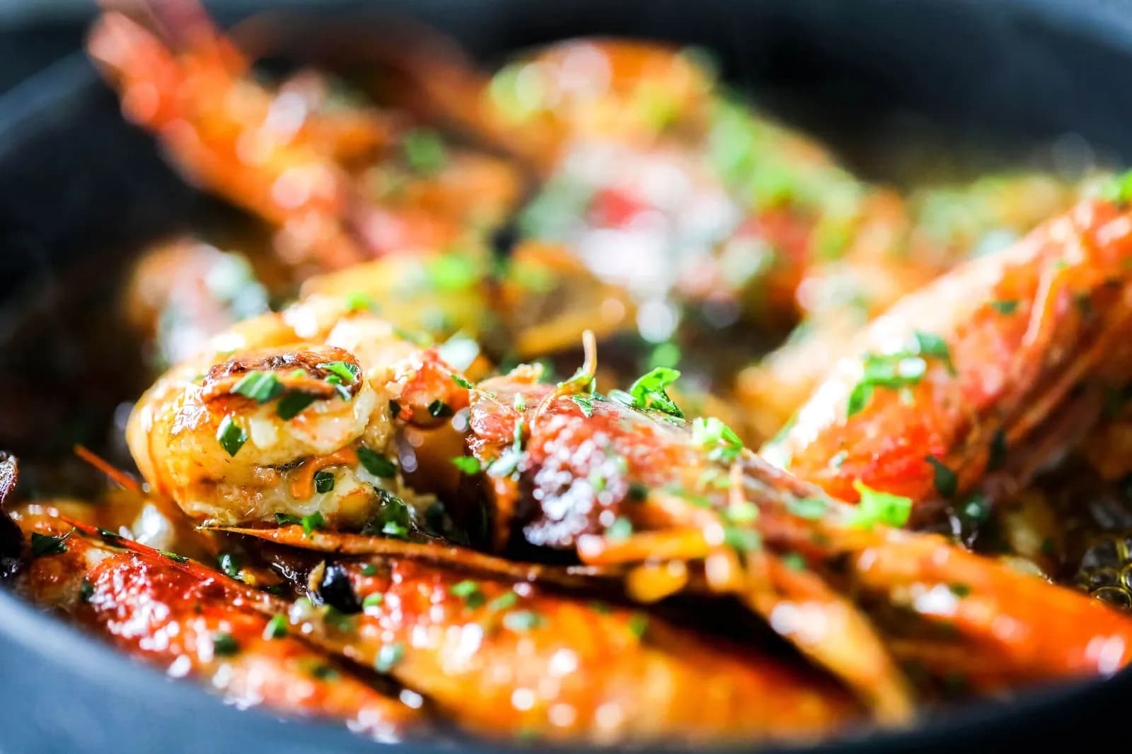 Roasted prawns in a pan at Okun restaurant in Palma