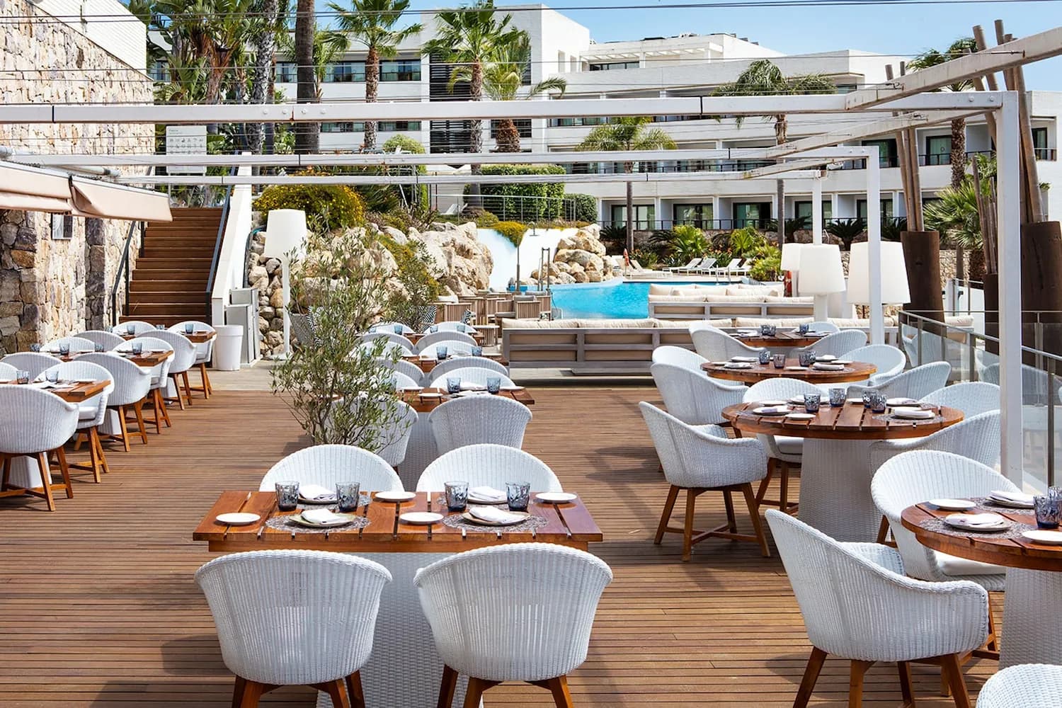 Verema restaurant terrace at Eurostars Sitges, laid tables under a pergola