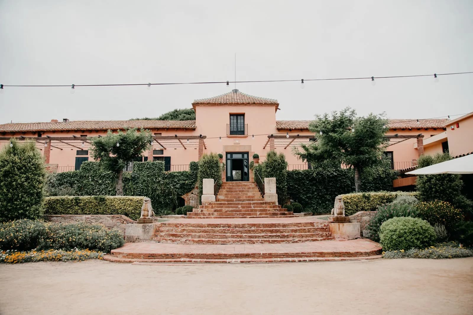 Facade and steps of La Torre dels Lleons near Barcelona, gardens for events