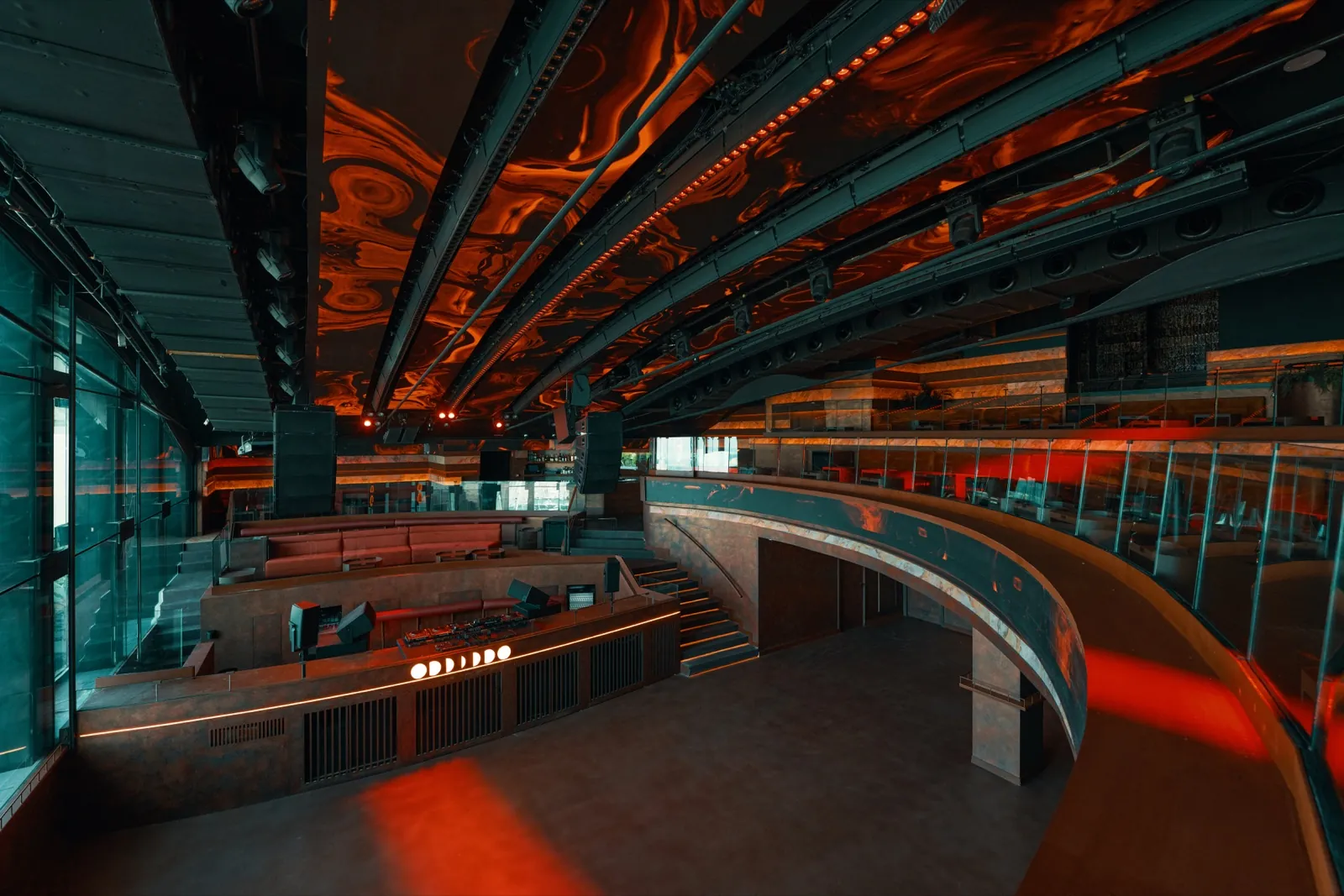 Space at Fitz Mallorca in Palma with orange patterned ceiling and curved bar