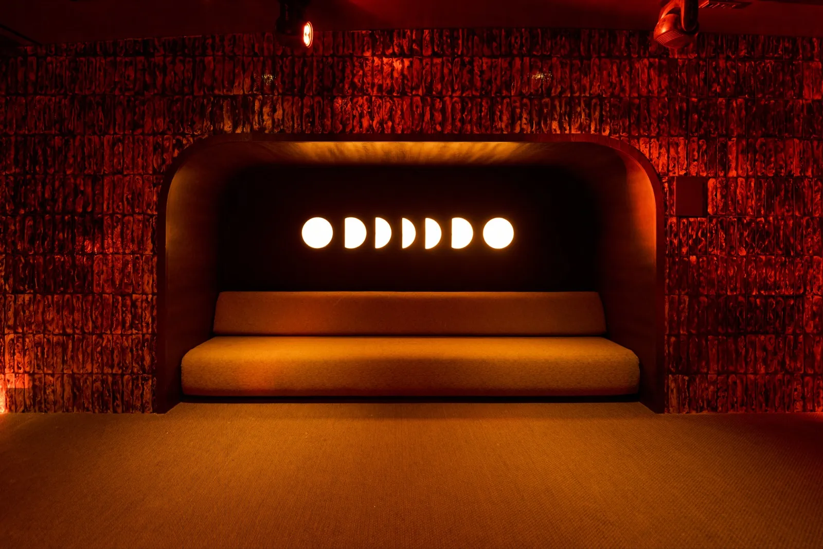Curved bar at Fitz Mallorca in Palma under orange and blue lighting