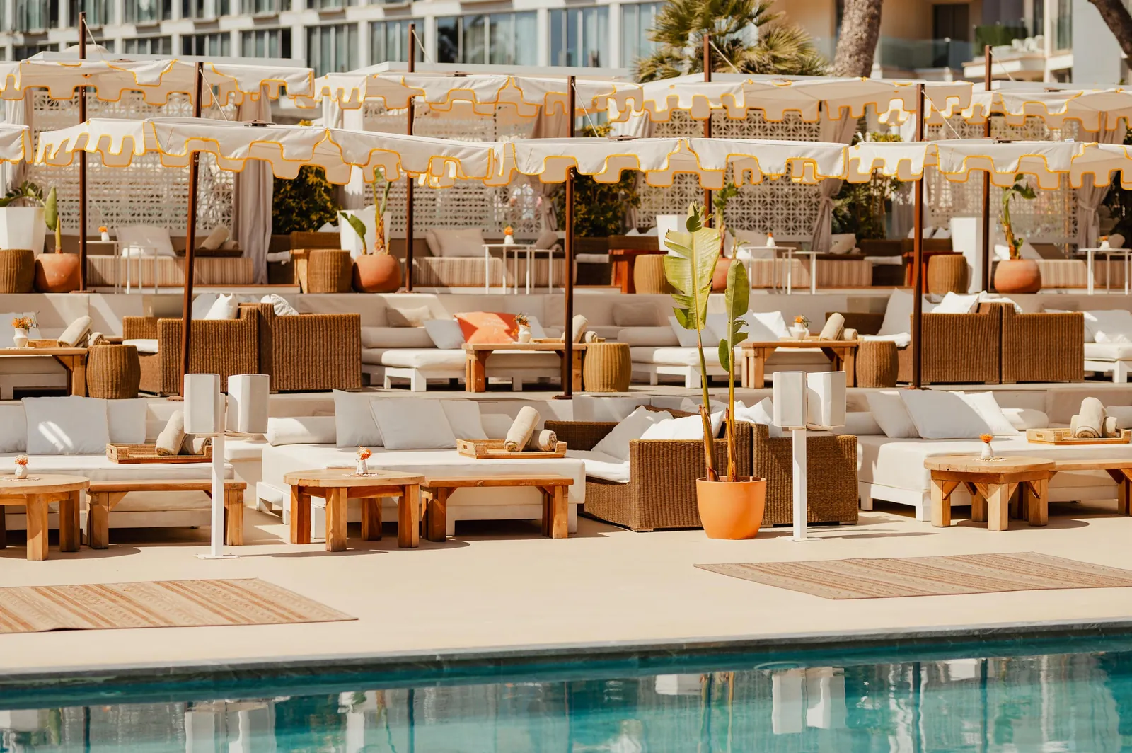 Lounge area at Nikki Beach Mallorca by the pool with white banquettes