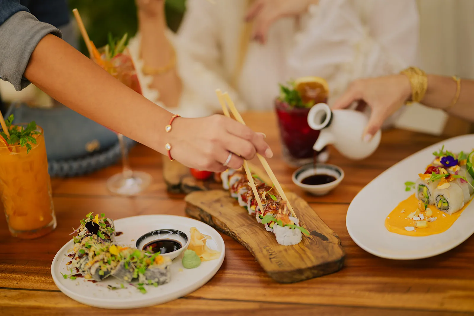 Sushi and dishes served on a table at Nikki Beach Marbella