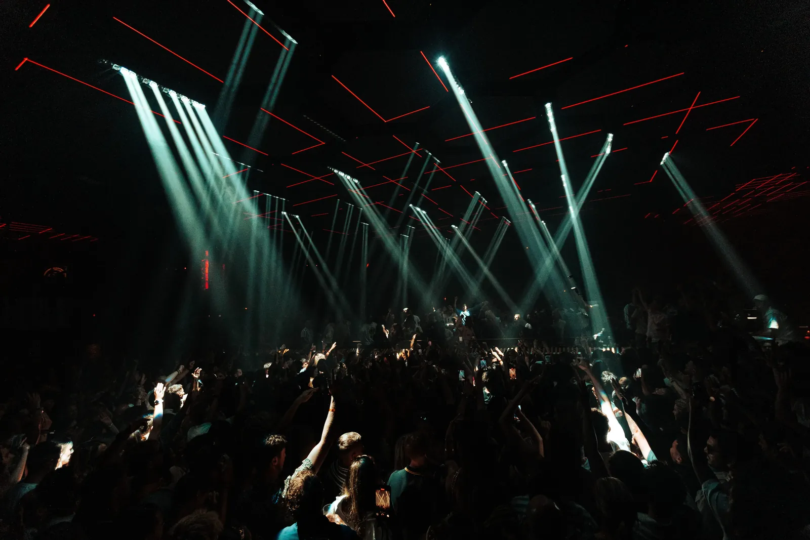 Crowd at Pacha Ibiza under light beams and lasers