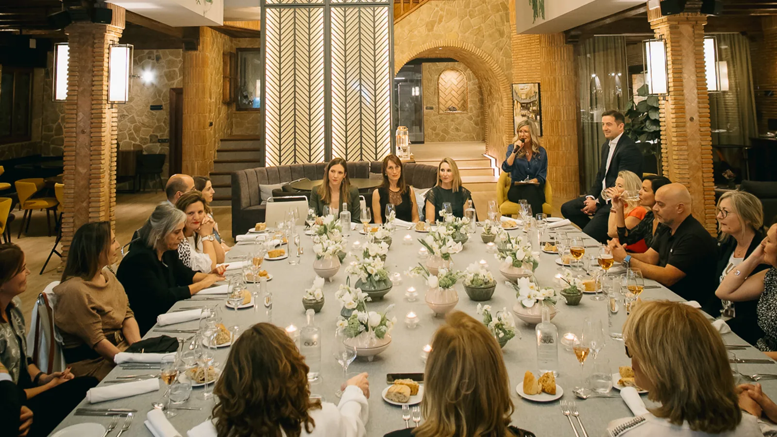 Long table set with flowers and glasses at an evening event at Uppery Club Málaga