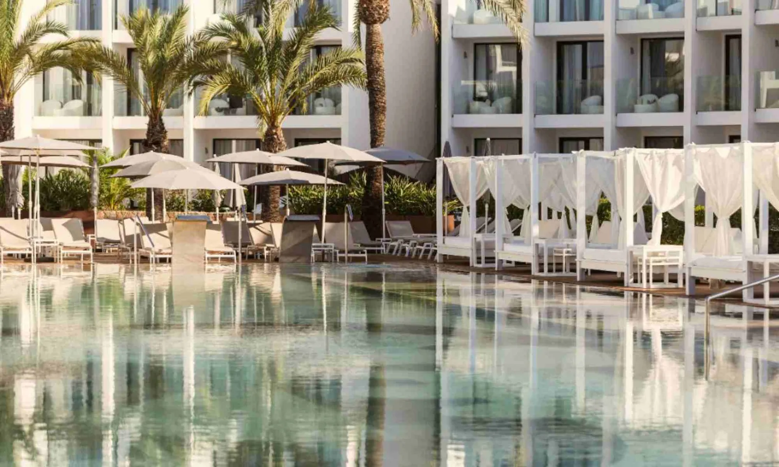 Pool lined with daybeds at BLESS Ibiza The Site