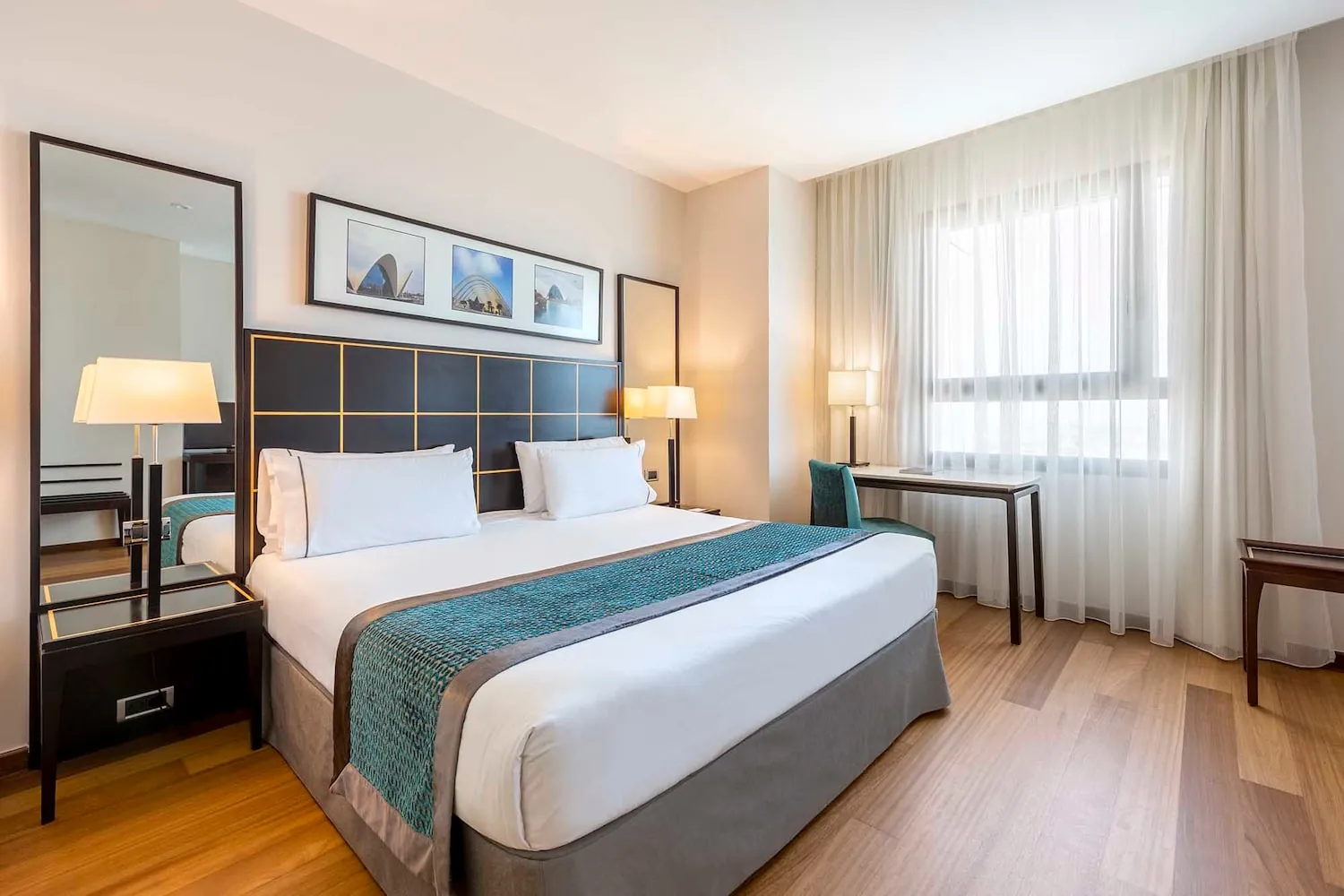 Double bedroom at Eurostars Gran Valencia hotel with wooden floor in Valencia