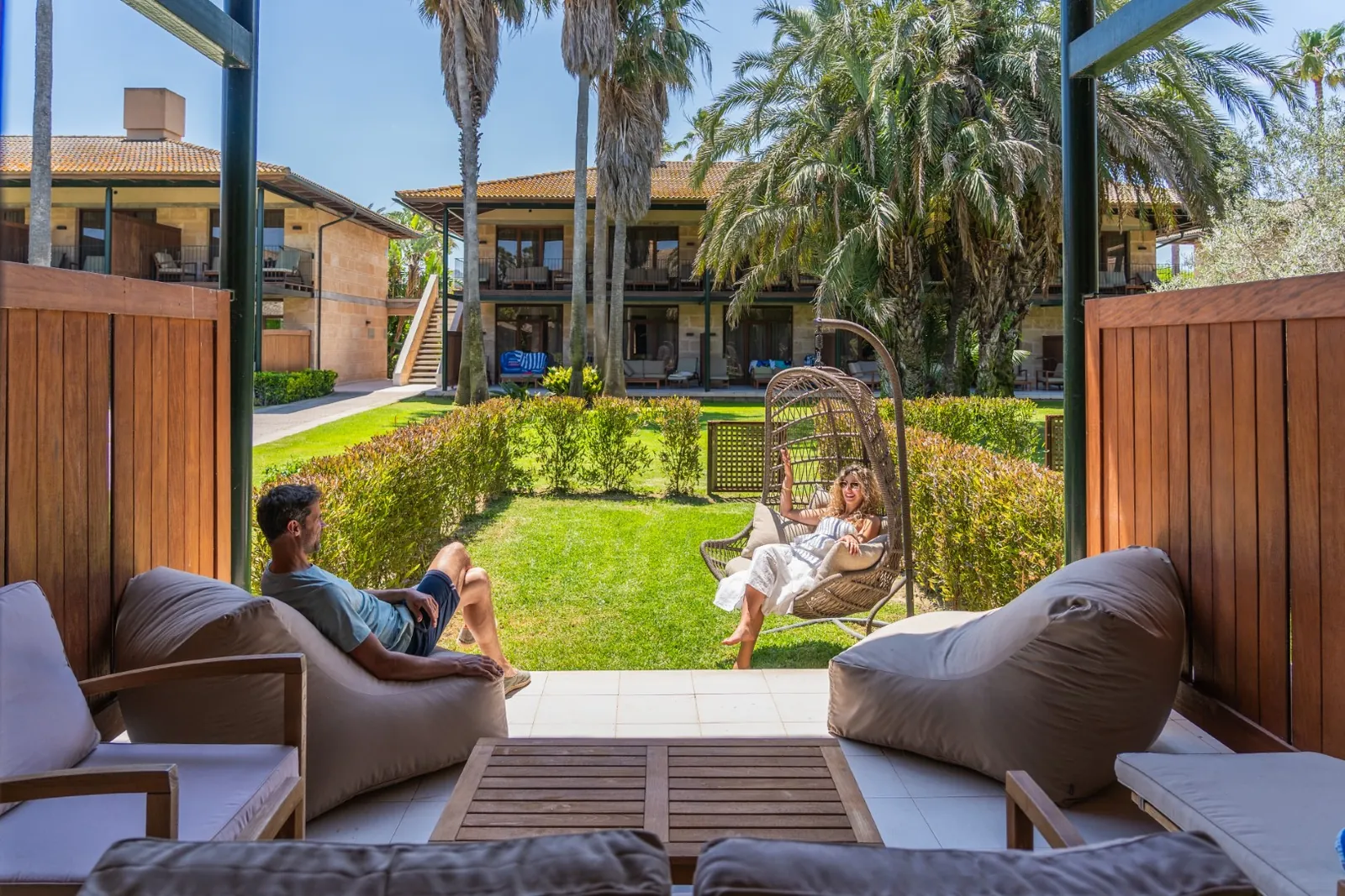 Garden of PortBlue Club Pollentia Resort & Spa with swing seat and armchairs