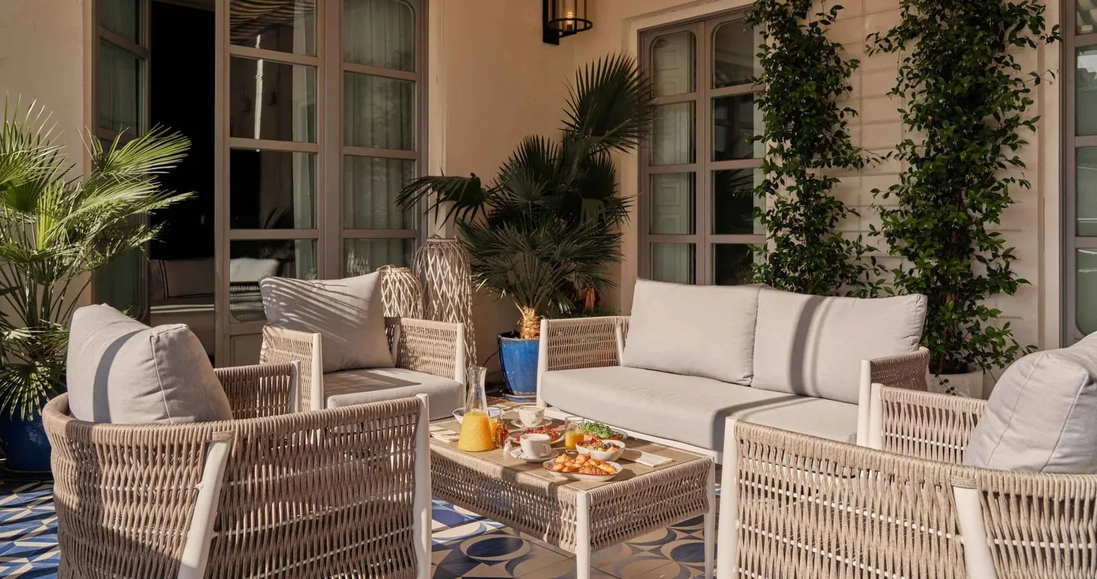 Lounge with rattan sofas and plants, Only YOU Boutique Hotel Madrid