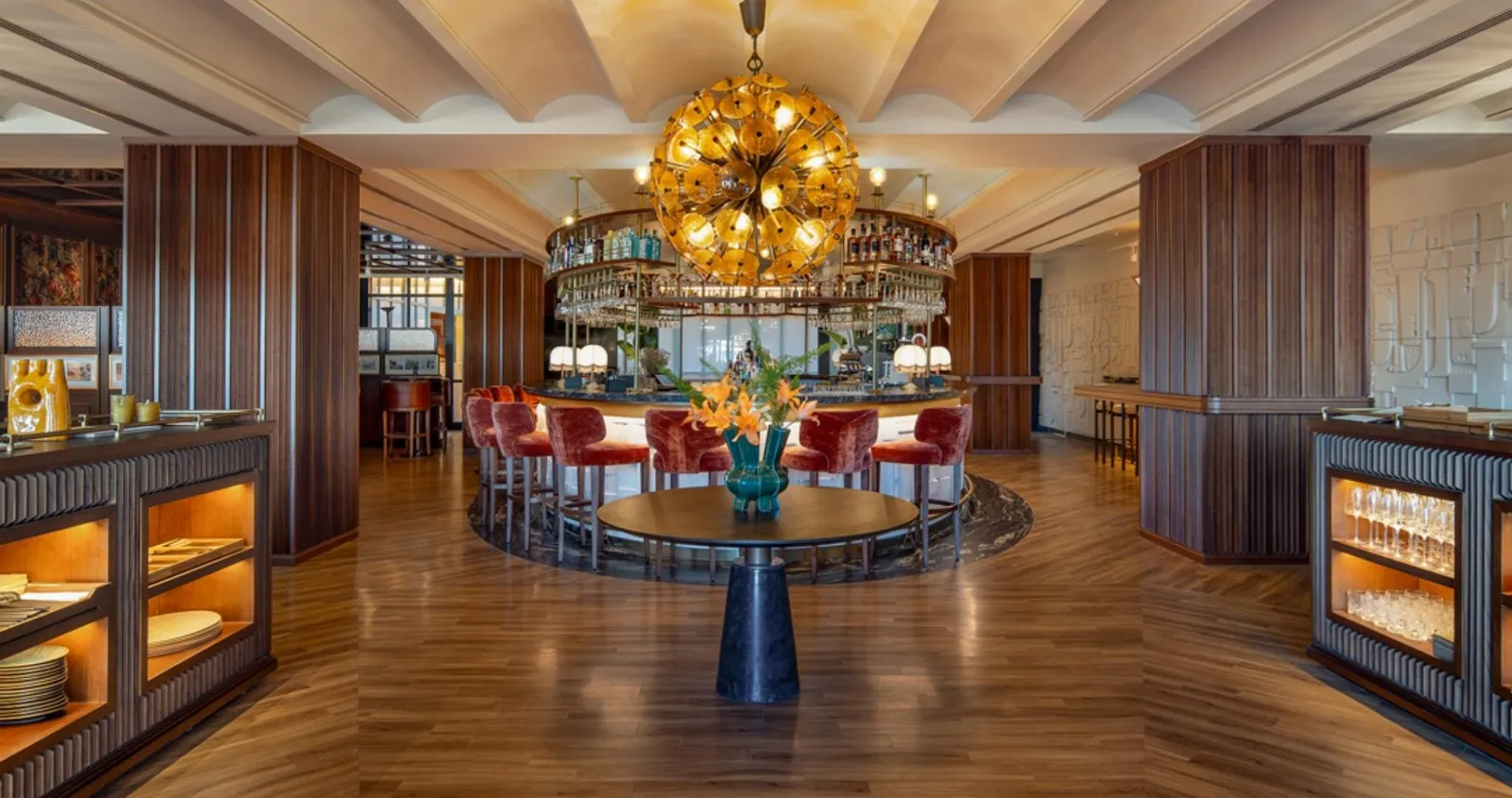 Bar lounge at Only YOU Hotel Sevilla under a golden chandelier