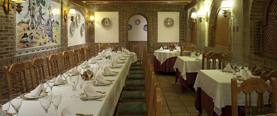 Asador Real dining room with set tables in central Madrid