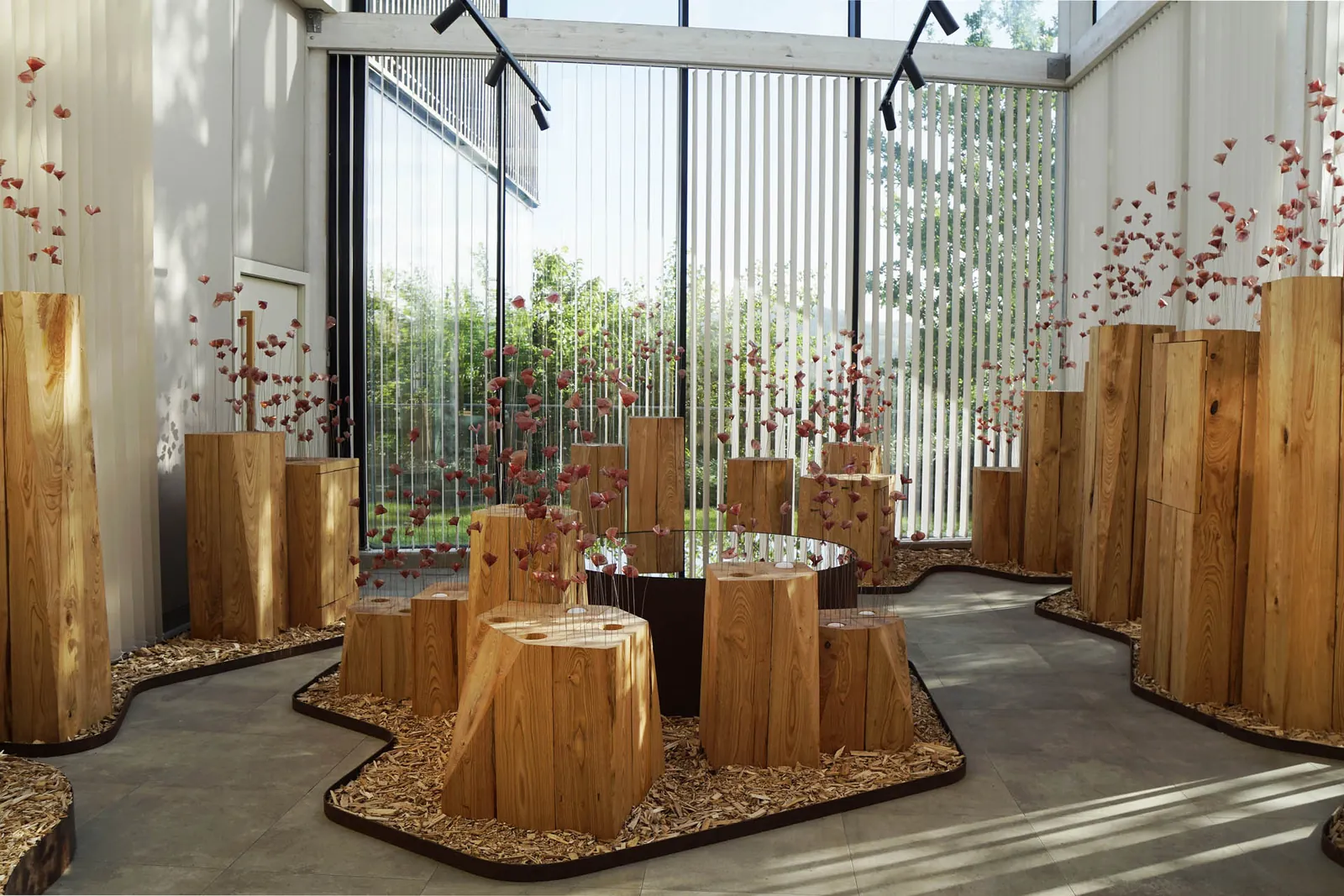 Dining hall with wooden trunks and large glass windows at Azurmendi