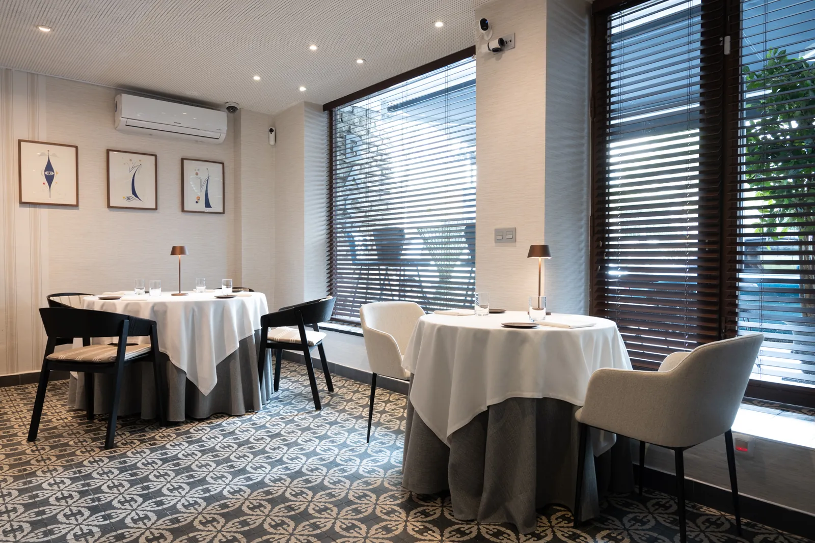 Bright dining room with large windows and set tables at Back in Marbella
