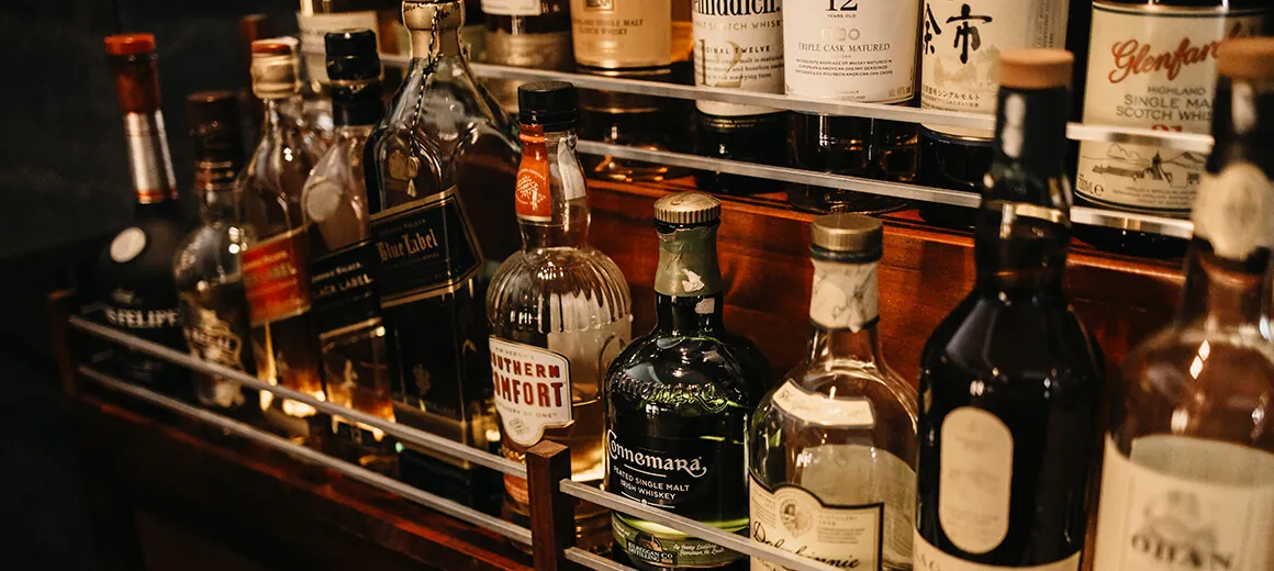 Shelf of spirit bottles at the Back restaurant bar in Marbella