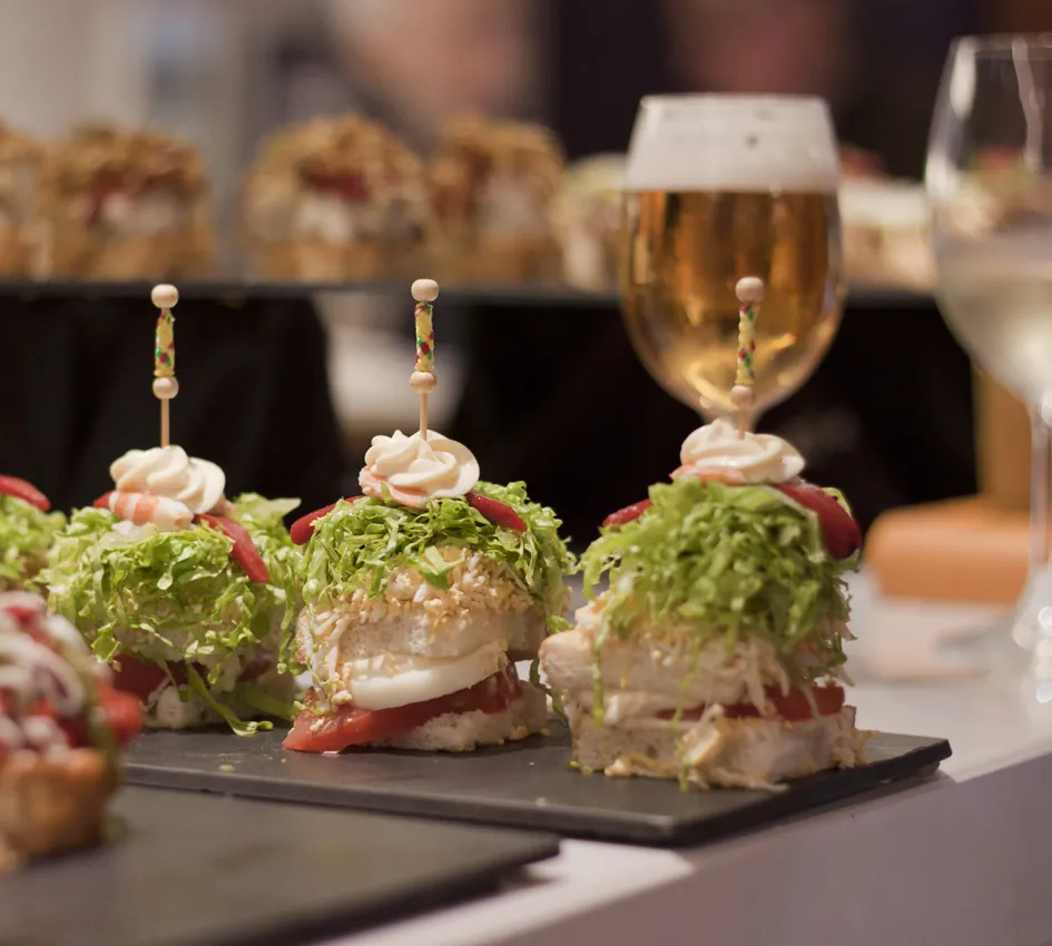 Garnished pinchos served with a beer at Bar Bergara in Donostia-San Sebastián
