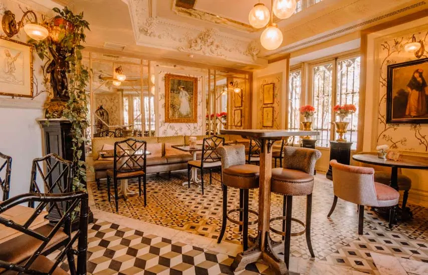 Café de Oriente dining room in Madrid with checkered floor and bar stools