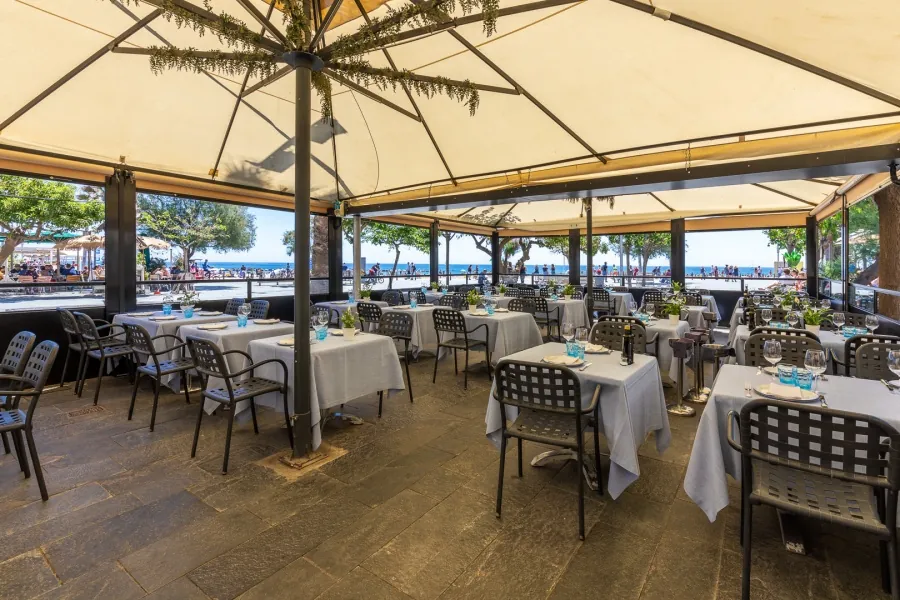 Can Majó outdoor dining room under awnings in Barcelona