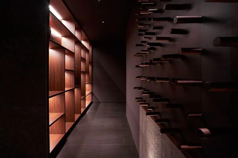 Illuminated wooden wall at Cinc Sentits restaurant in Barcelona