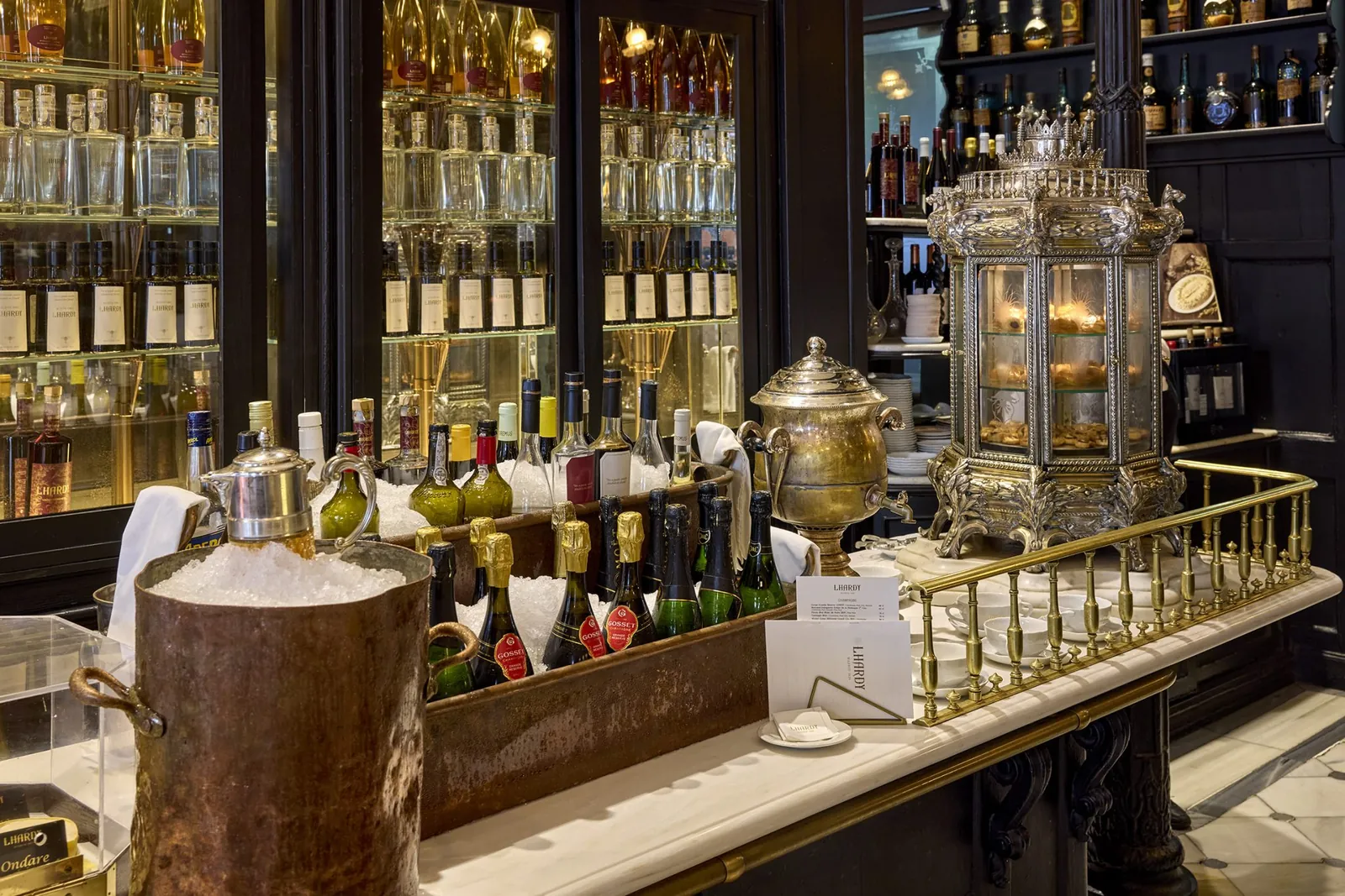 Bottle display and vintage samovar at Lhardy restaurant in Madrid