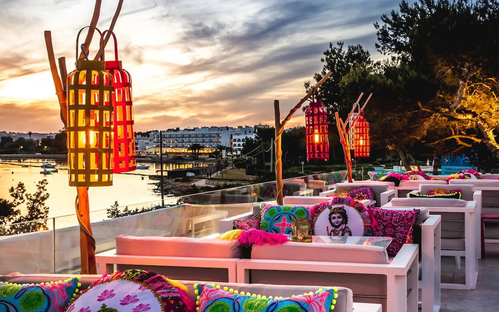 Sunset terrace with lanterns and colourful banquettes at Sa Punta in Ibiza