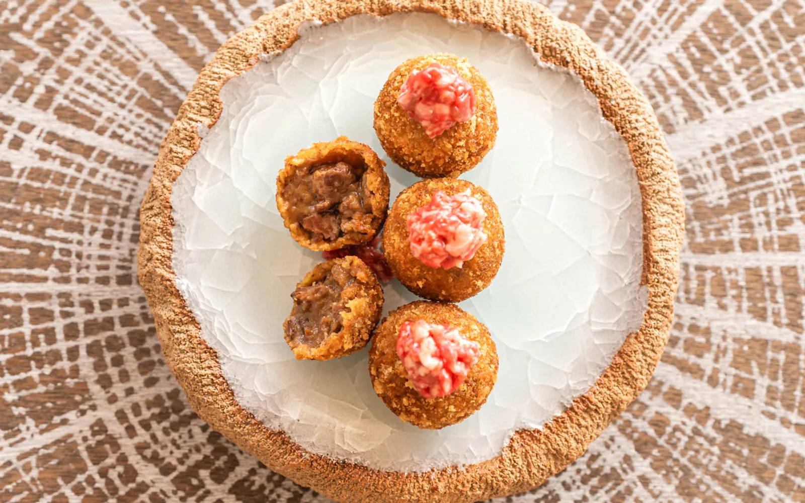 Golden bite-sized dishes served at Sa Punta in Ibiza