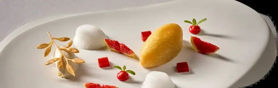 Seasonal dish at Skina restaurant in Marbella, white plating with red accents