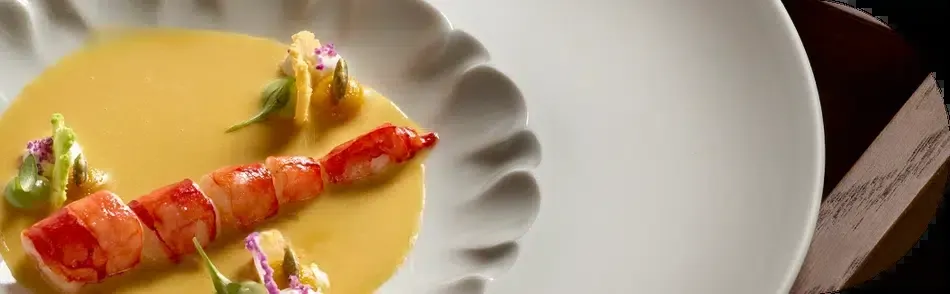 Shellfish slice on orange cream, a creation at Skina restaurant in Marbella