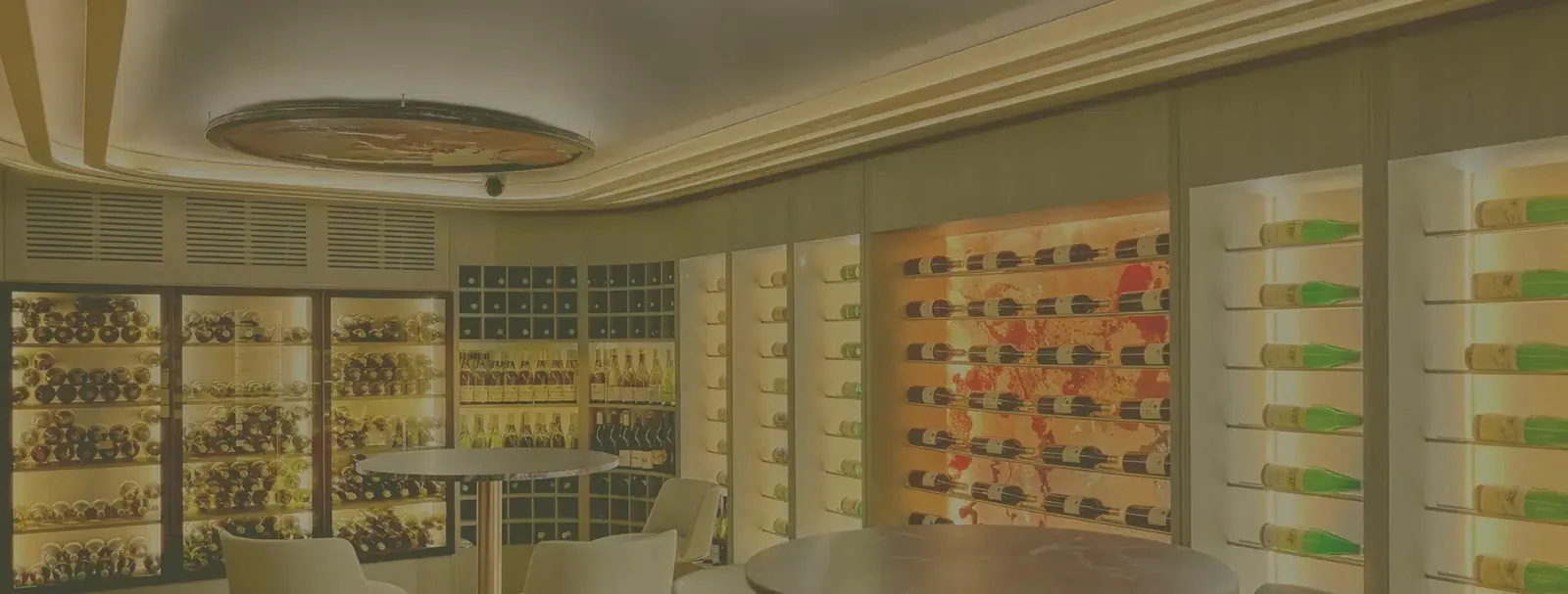 Skina restaurant wine cellar in Marbella, bottles displayed in illuminated shelves
