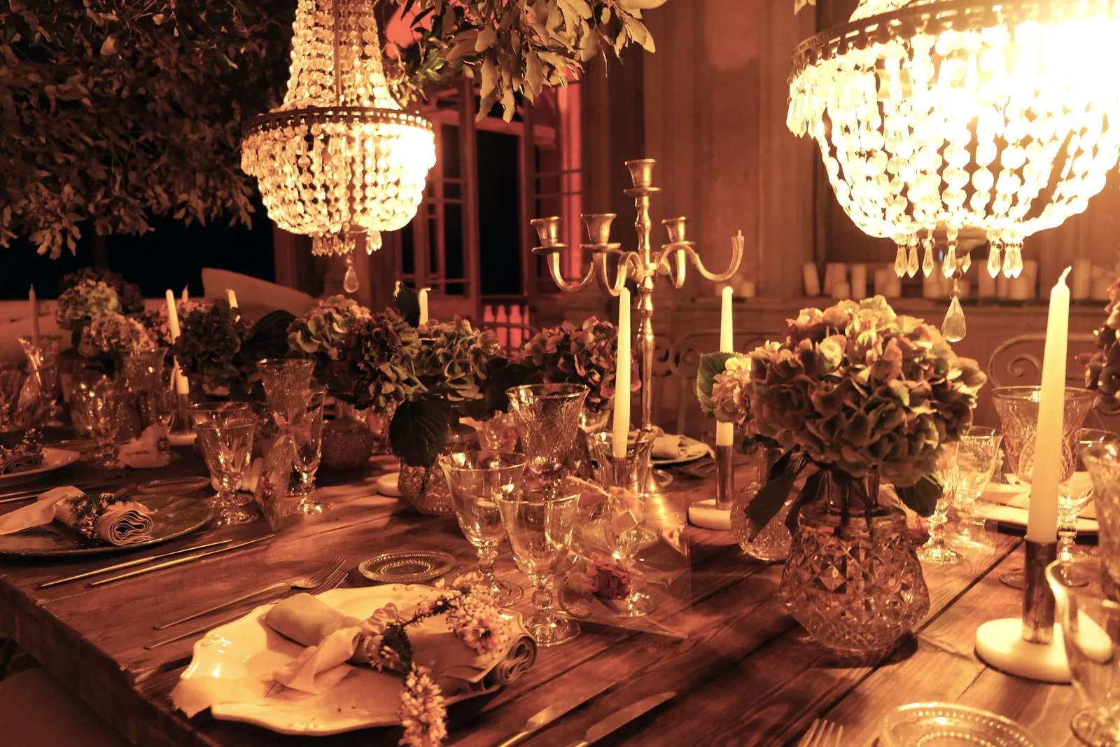Table set by candlelight inside the house